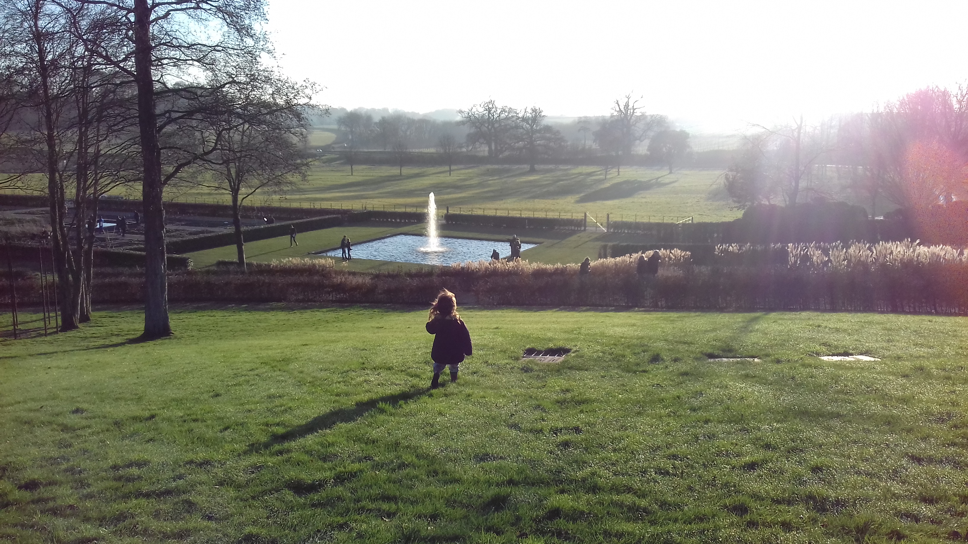 One of the fountains with expansive green views