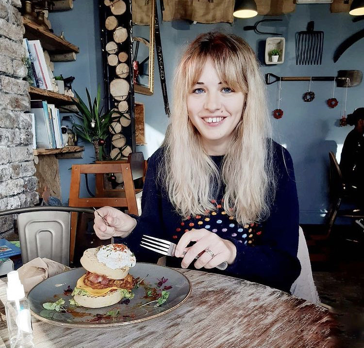 Wendy eating breakfast in a lovely cafe