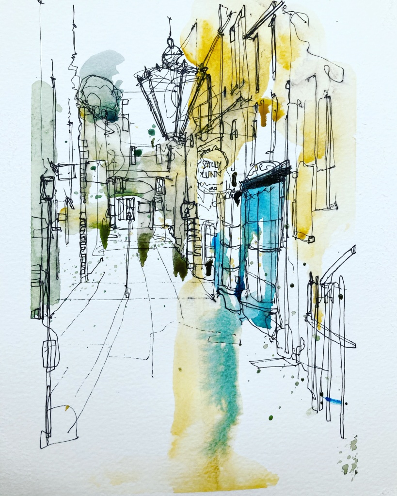 A lantern is the central object in this street scene with glorious hopeful touches of blue and yellow in the scene