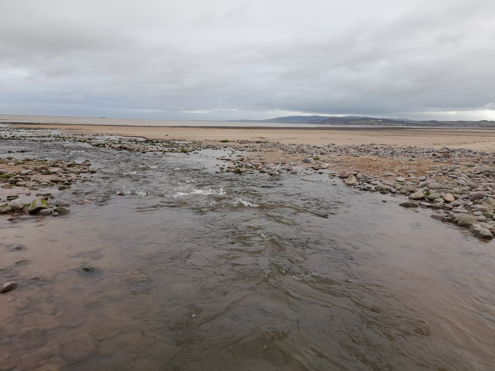 Muted tones of the sea and sand and sky.